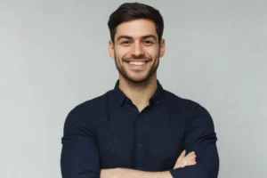 Smiling man standing confidently with arms crossed promoting men's health awareness.